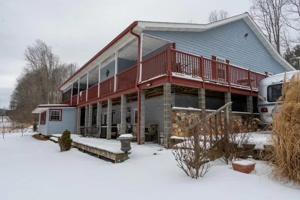a view of house with outdoor space and porch
