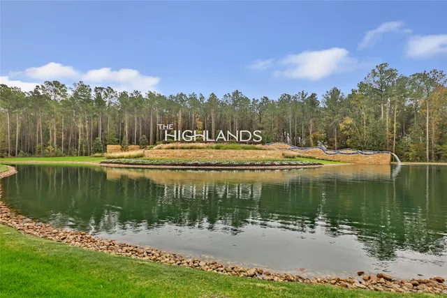 a view of a lake with a big yard