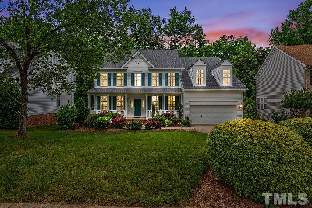 1277 Horsham Way Apex, NC 27502 - Photo 1 of 43 a front view of a house with garden