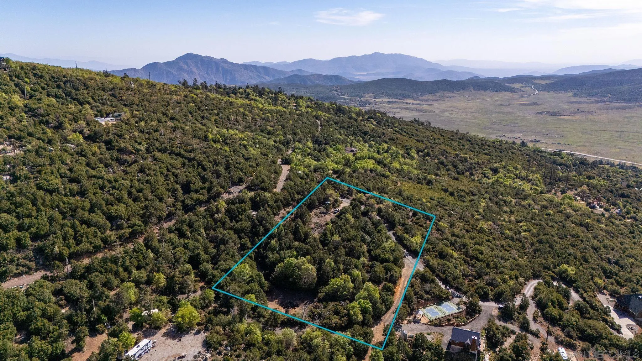 15962 North Peak Road, Unit 39 Julian, CA 92036 - Photo 14 of 16 a view of a lush green field with lots of bushes