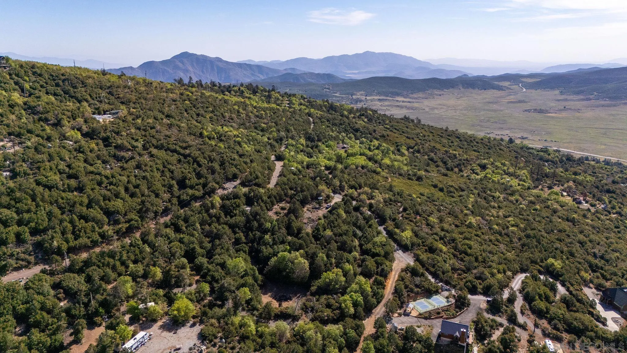 15962 North Peak Road, Unit 39 Julian, CA 92036 - Photo 15 of 16 a view of a lush green field with lots of bushes