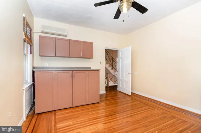 a view of a kitchen with a microwave and cabinets