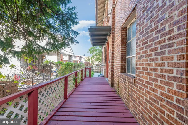 a view of a balcony with wooden floor