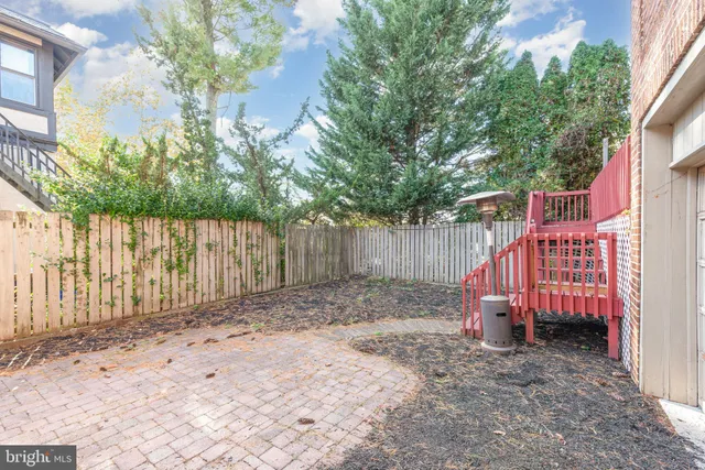 a view of a backyard with a small cabin and chair