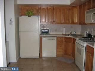 1209-17 Norwalk Road, Unit 11 Philadelphia, PA 19115 - Photo 3 of 5 a kitchen with a sink and cabinets
