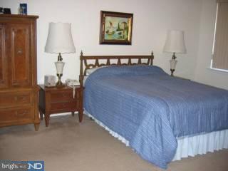 1209-17 Norwalk Road, Unit 11 Philadelphia, PA 19115 - Photo 4 of 5 a bedroom with a bed and window