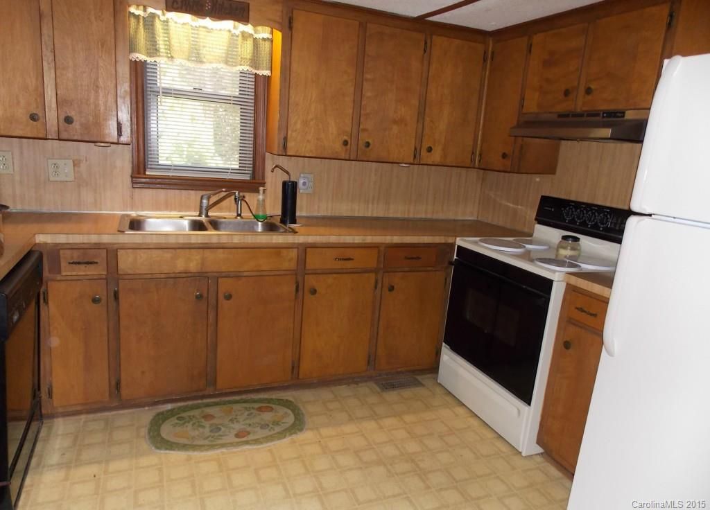 1882 New Cut Church Road Lancaster, SC 29720 - Photo 11 of 21 a kitchen with a sink stove and cabinets