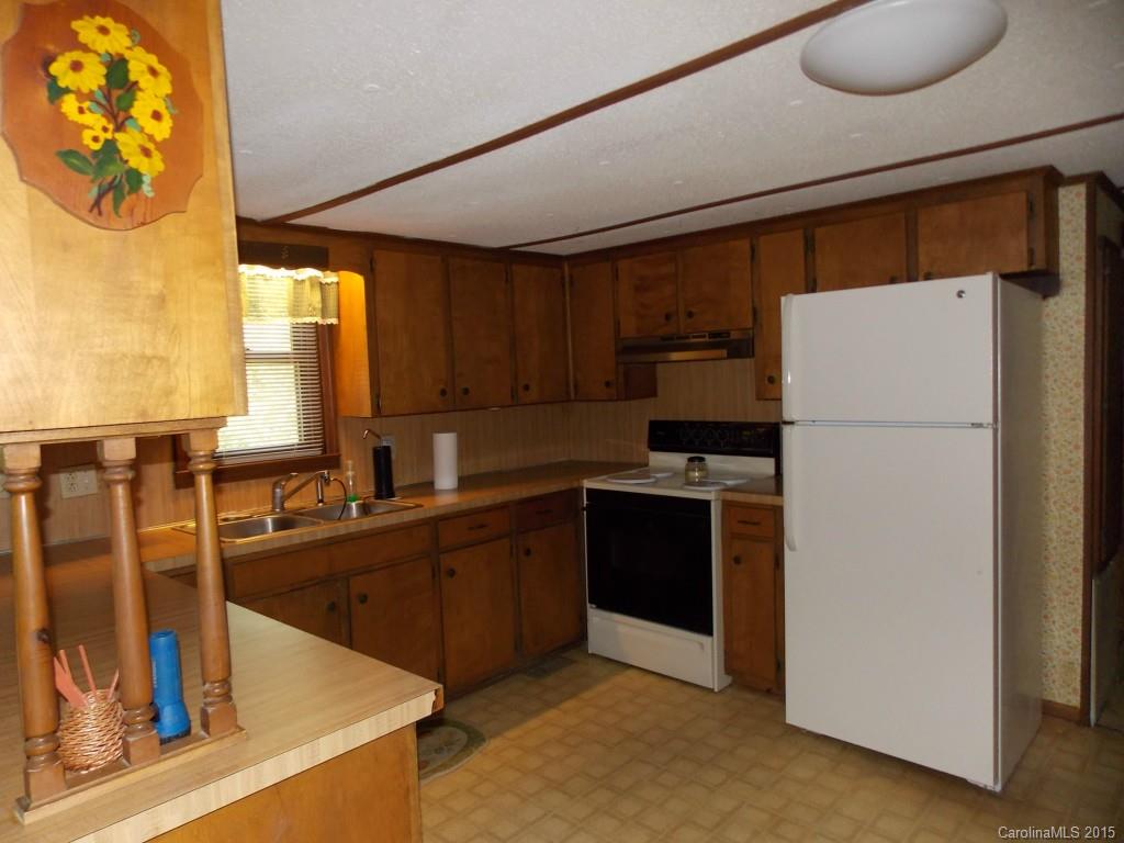 1882 New Cut Church Road Lancaster, SC 29720 - Photo 10 of 21 a kitchen with stainless steel appliances granite countertop a refrigerator a sink and a stove