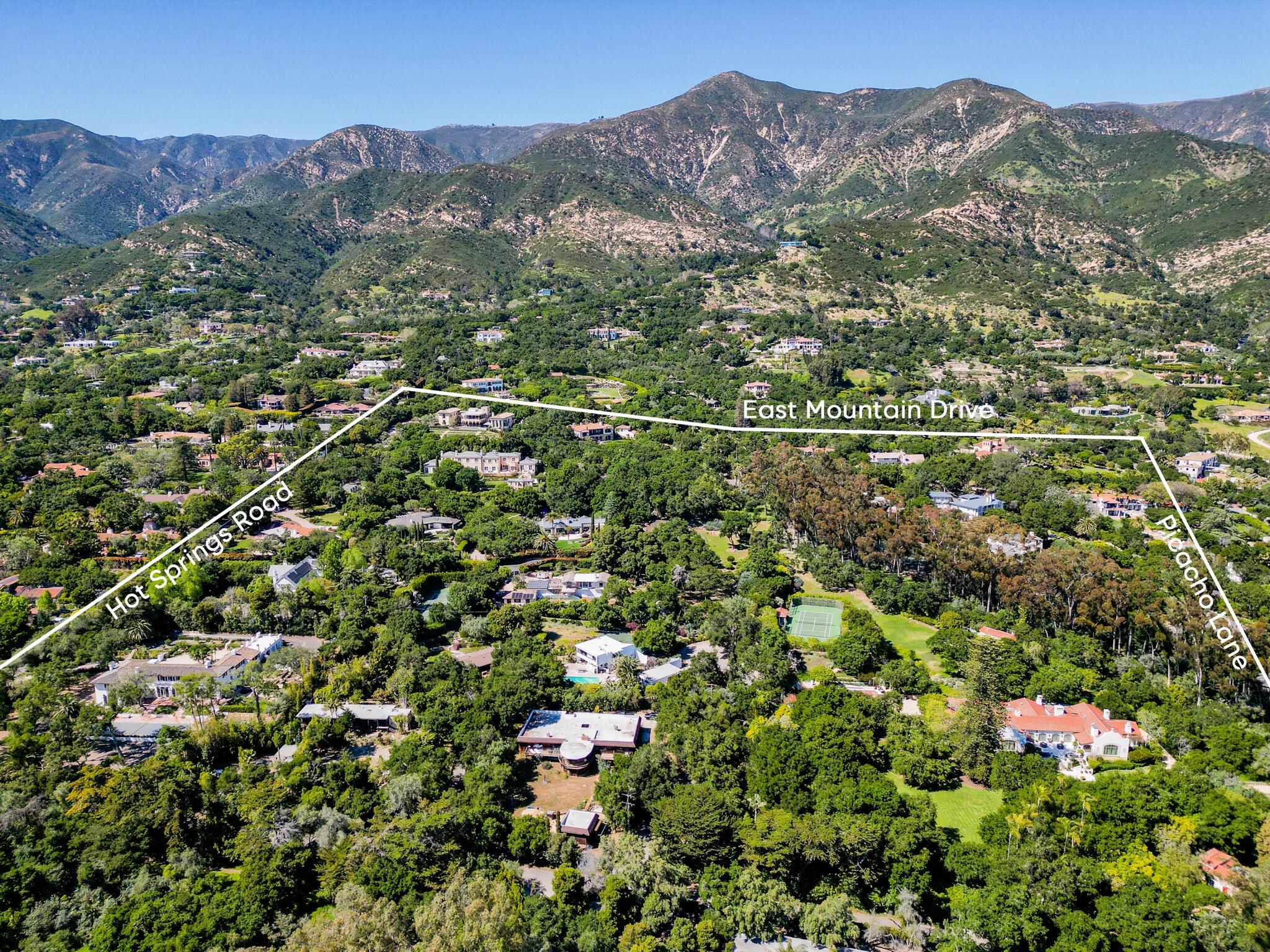 756 Hot Springs Road Montecito, CA 93108 - Photo 2 of 32 an aerial view of a houses with a lush green hillside