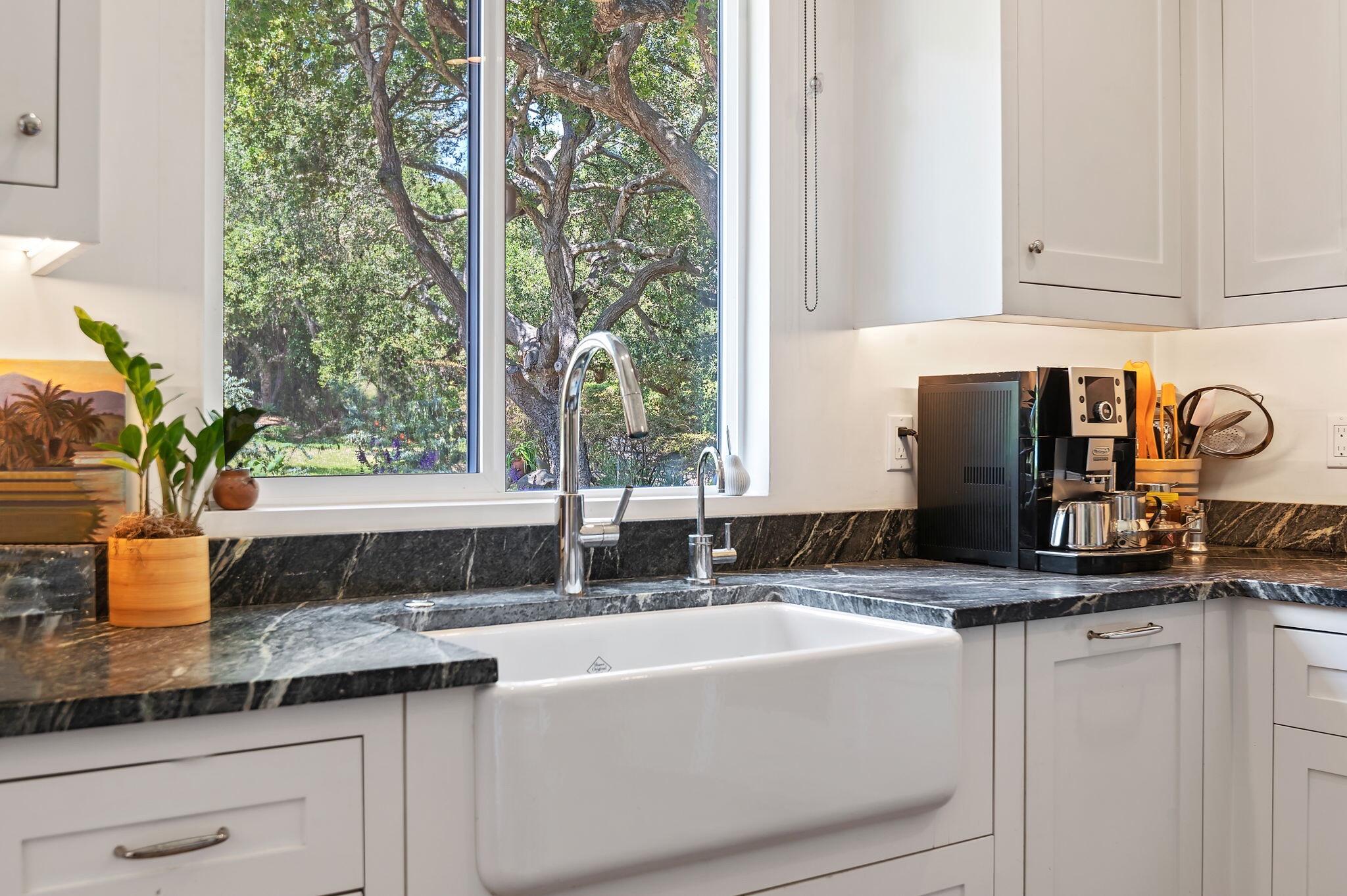 756 Hot Springs Road Montecito, CA 93108 - Photo 24 of 32 a bathroom with a granite countertop sink and a window