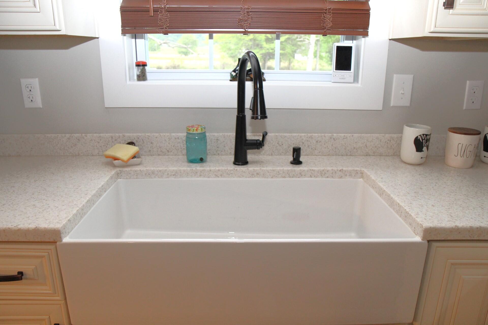 5750 Harmons Lick Road Paint Lick, KY 40461 - Photo 16 of 31 Farmhouse sink with window facing pond
