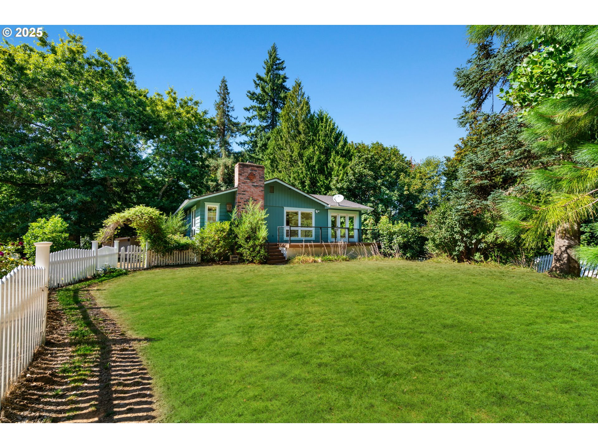 901 Northwest 319th Street Ridgefield, WA 98642 - Photo 3 of 38 a backyard of a house with table and chairs