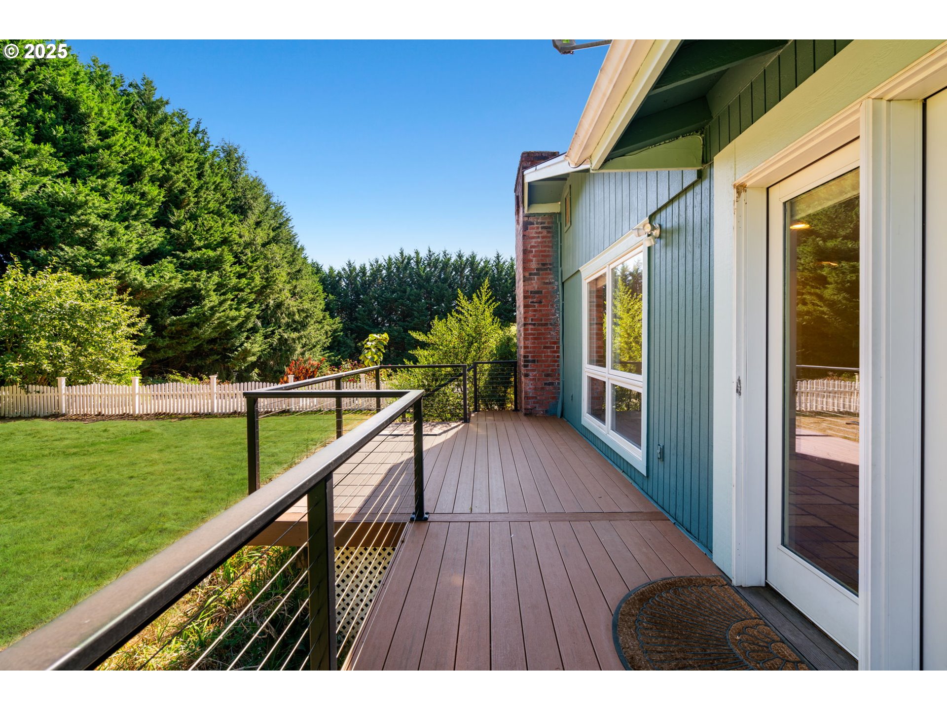 901 Northwest 319th Street Ridgefield, WA 98642 - Photo 36 of 38 a view of balcony with yard and outdoor seating