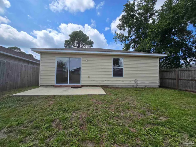 a view of a backyard with a cabin