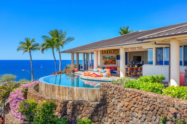 a view of a backyard with plants and a patio