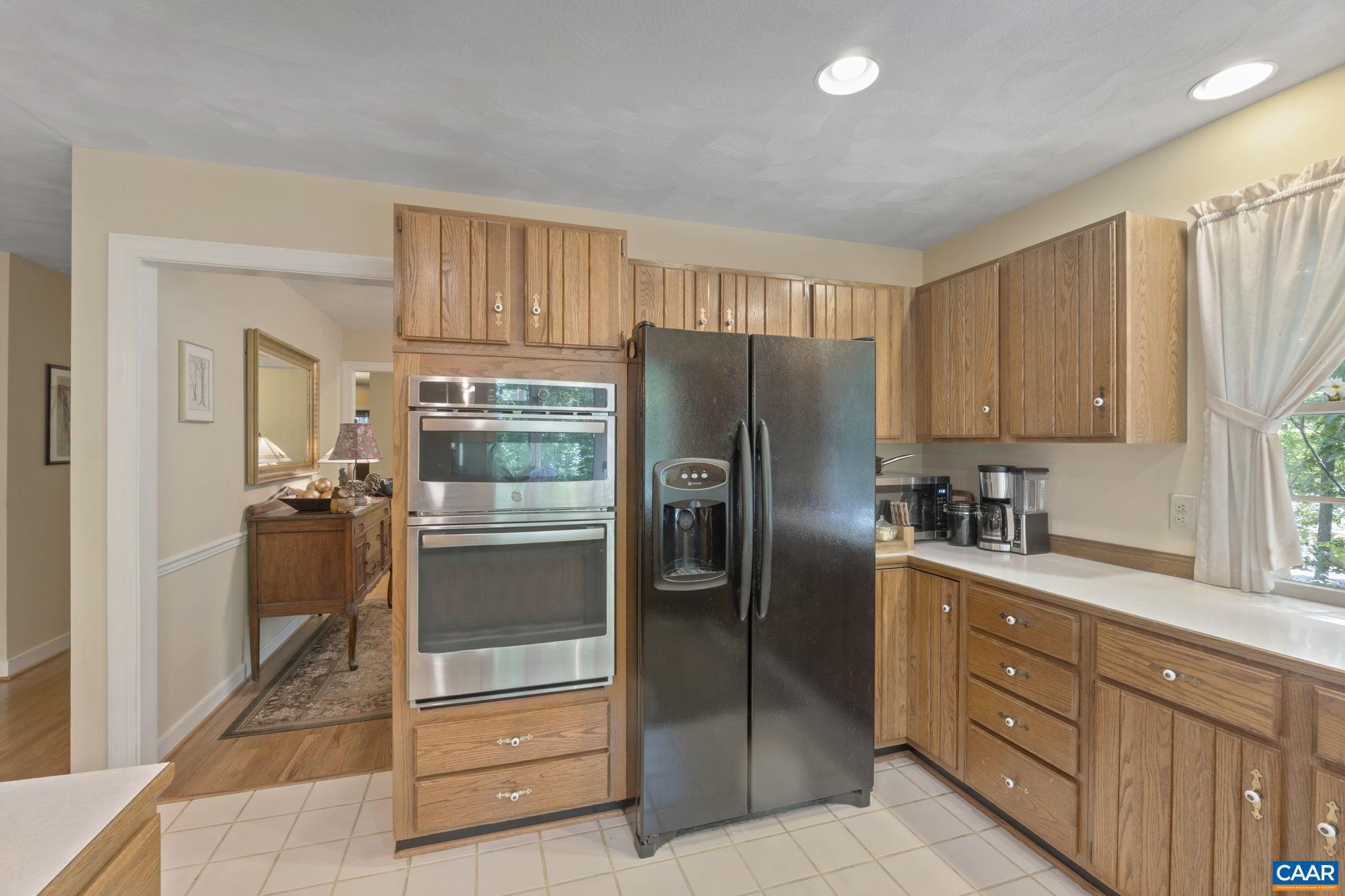 2 Whippoorwill Lane Palmyra, VA 22963 - Photo 11 of 36 a kitchen with granite countertop a refrigerator and a sink