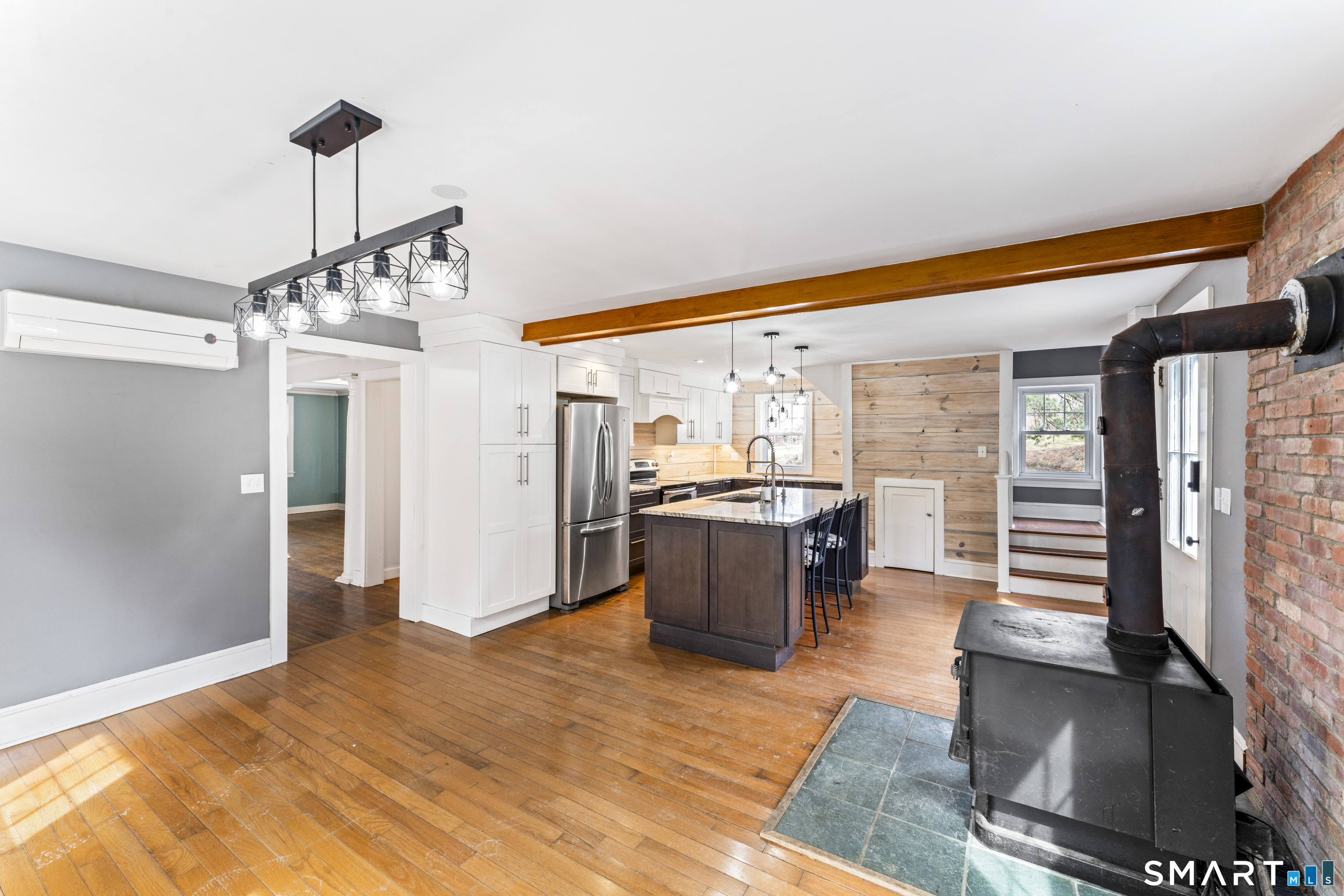 74 Middle Quarter Road Woodbury, CT 06798 - Photo 16 of 40 a view of a dining room with furniture window and wooden floor
