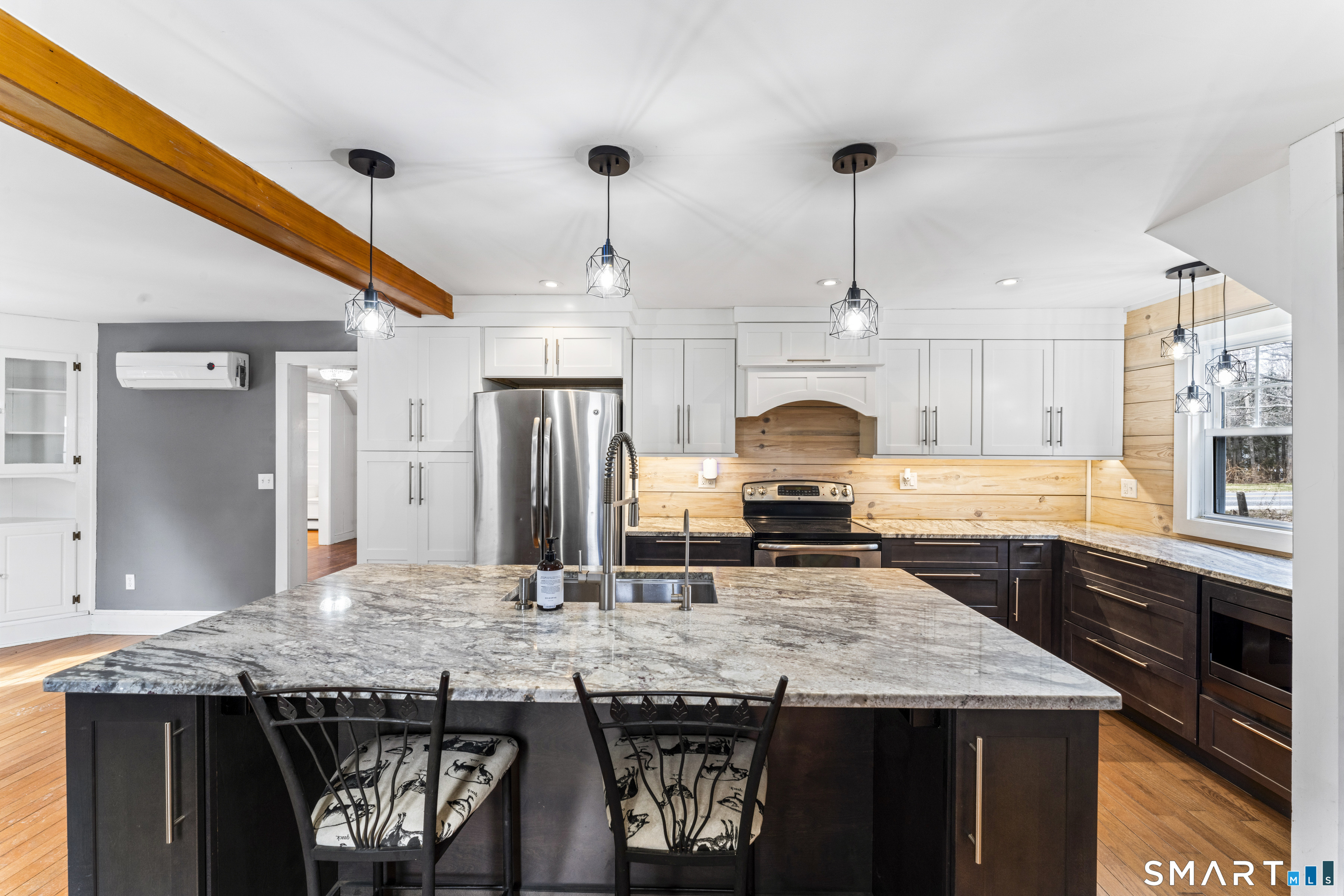 74 Middle Quarter Road Woodbury, CT 06798 - Photo 17 of 40 a kitchen with granite countertop kitchen island stainless steel appliances a sink and wooden cabinets