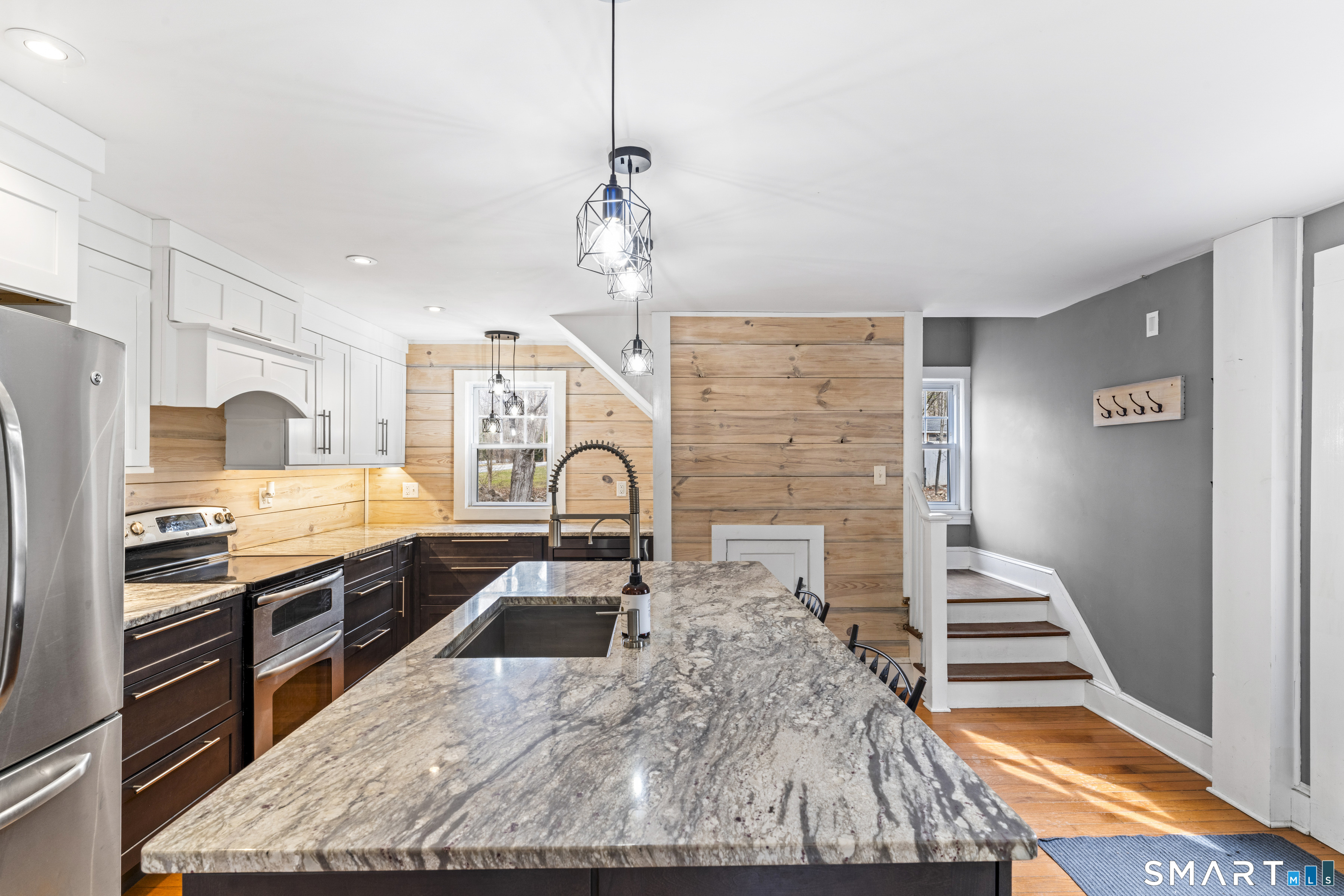 74 Middle Quarter Road Woodbury, CT 06798 - Photo 18 of 40 a kitchen with stainless steel appliances granite countertop a stove a sink and a refrigerator
