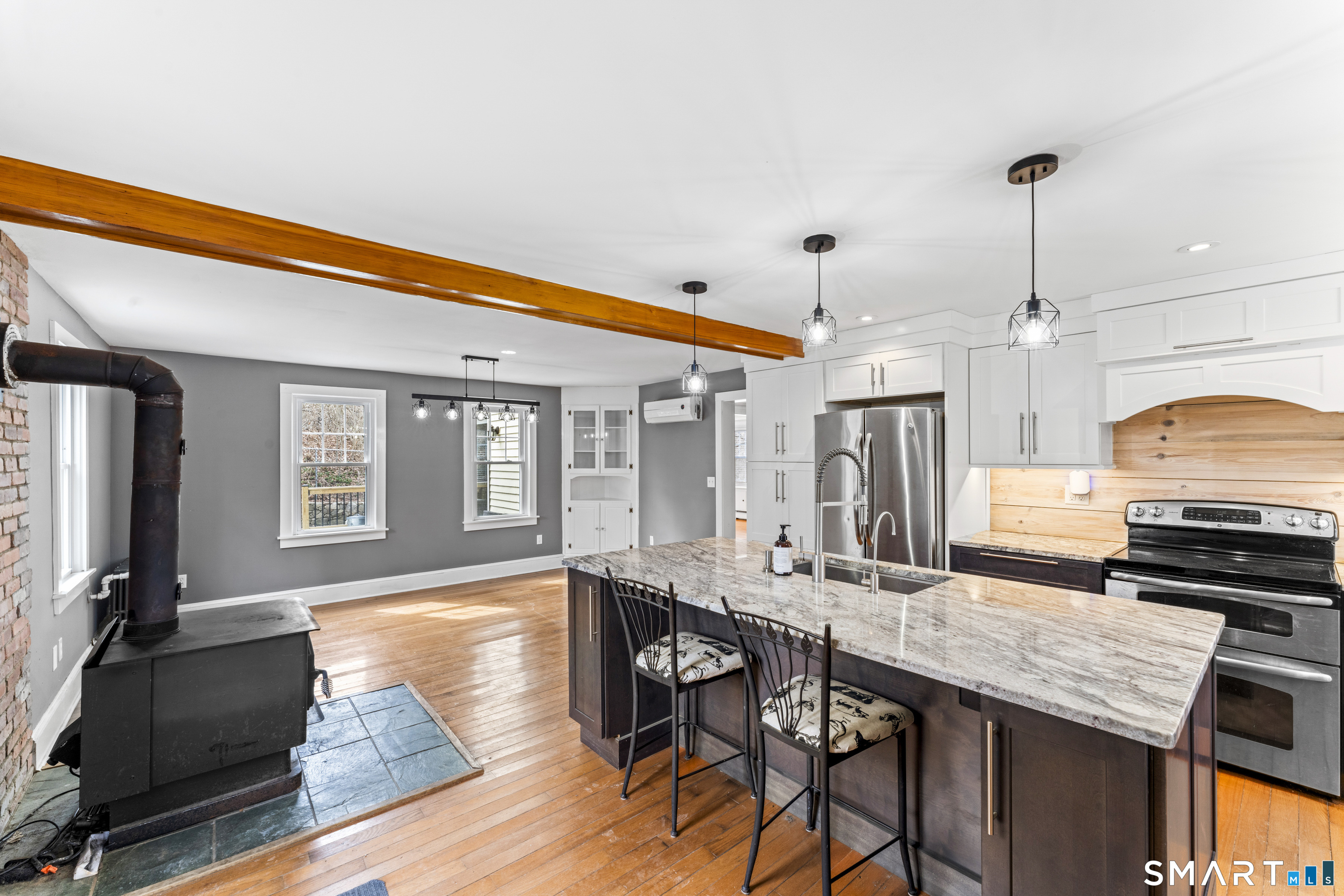 74 Middle Quarter Road Woodbury, CT 06798 - Photo 20 of 40 a kitchen with granite countertop a stove a sink and a refrigerator