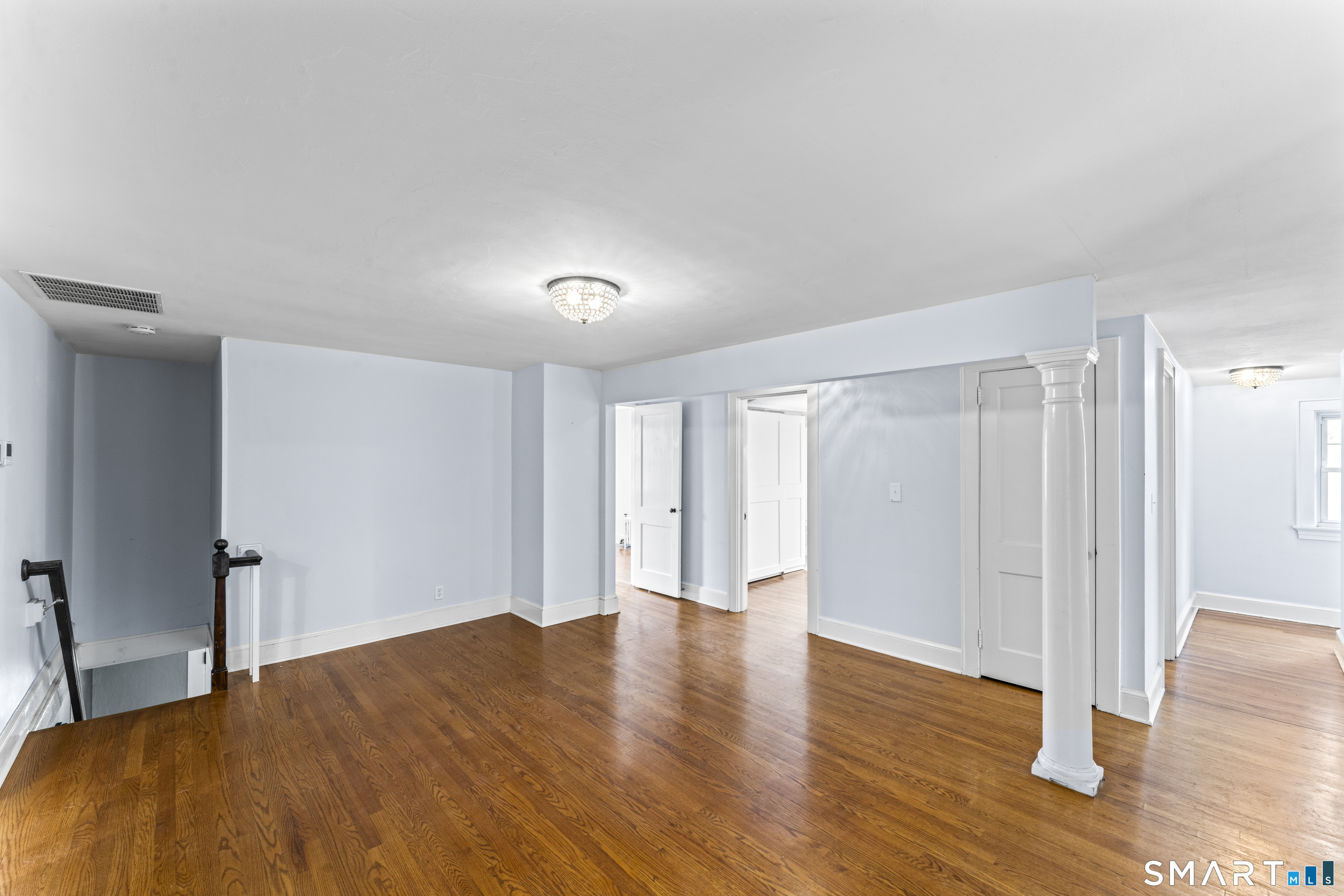 74 Middle Quarter Road Woodbury, CT 06798 - Photo 21 of 40 a big room with wooden floor and closet area