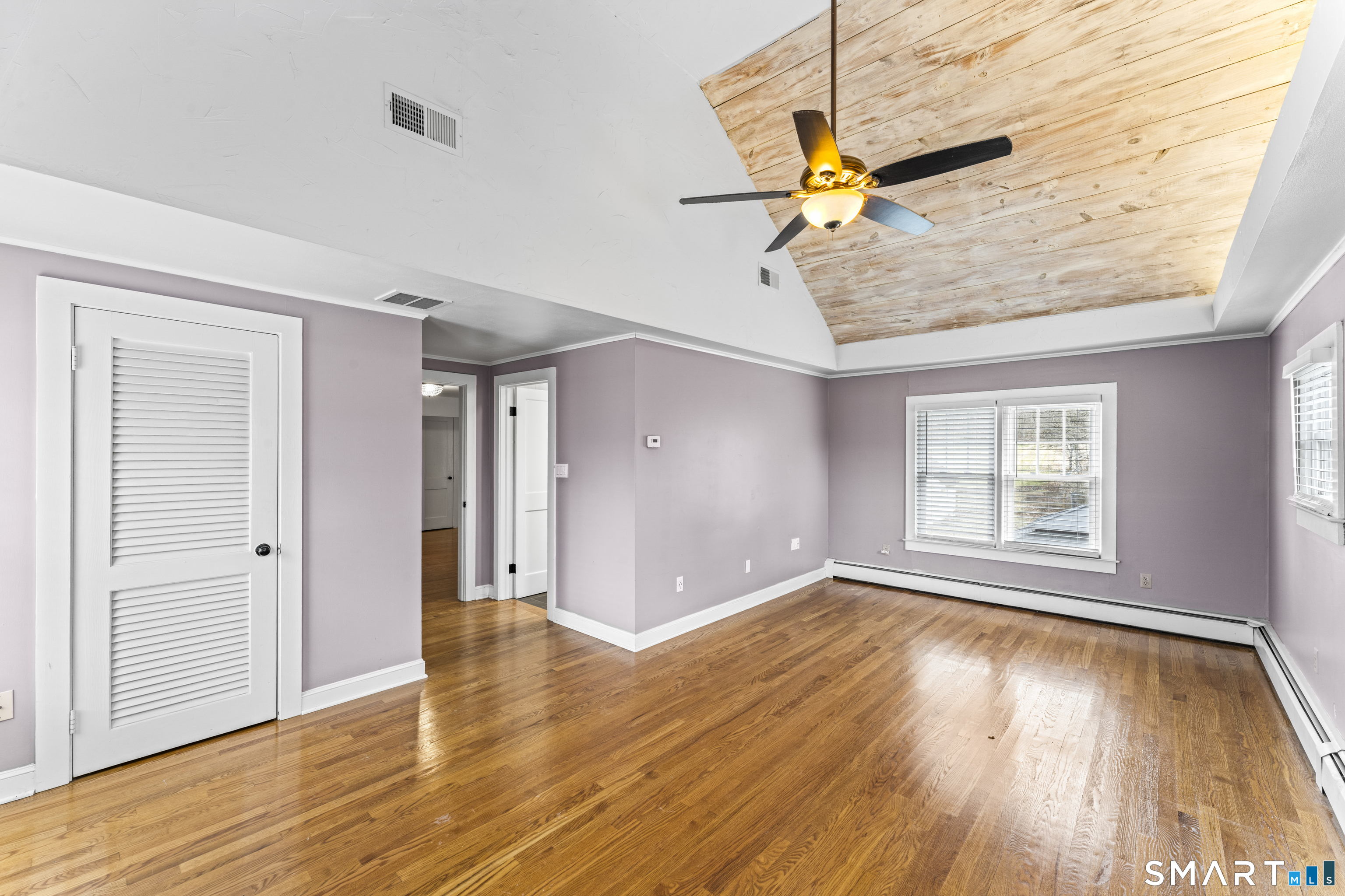 74 Middle Quarter Road Woodbury, CT 06798 - Photo 26 of 40 wooden floor in an empty room with a window