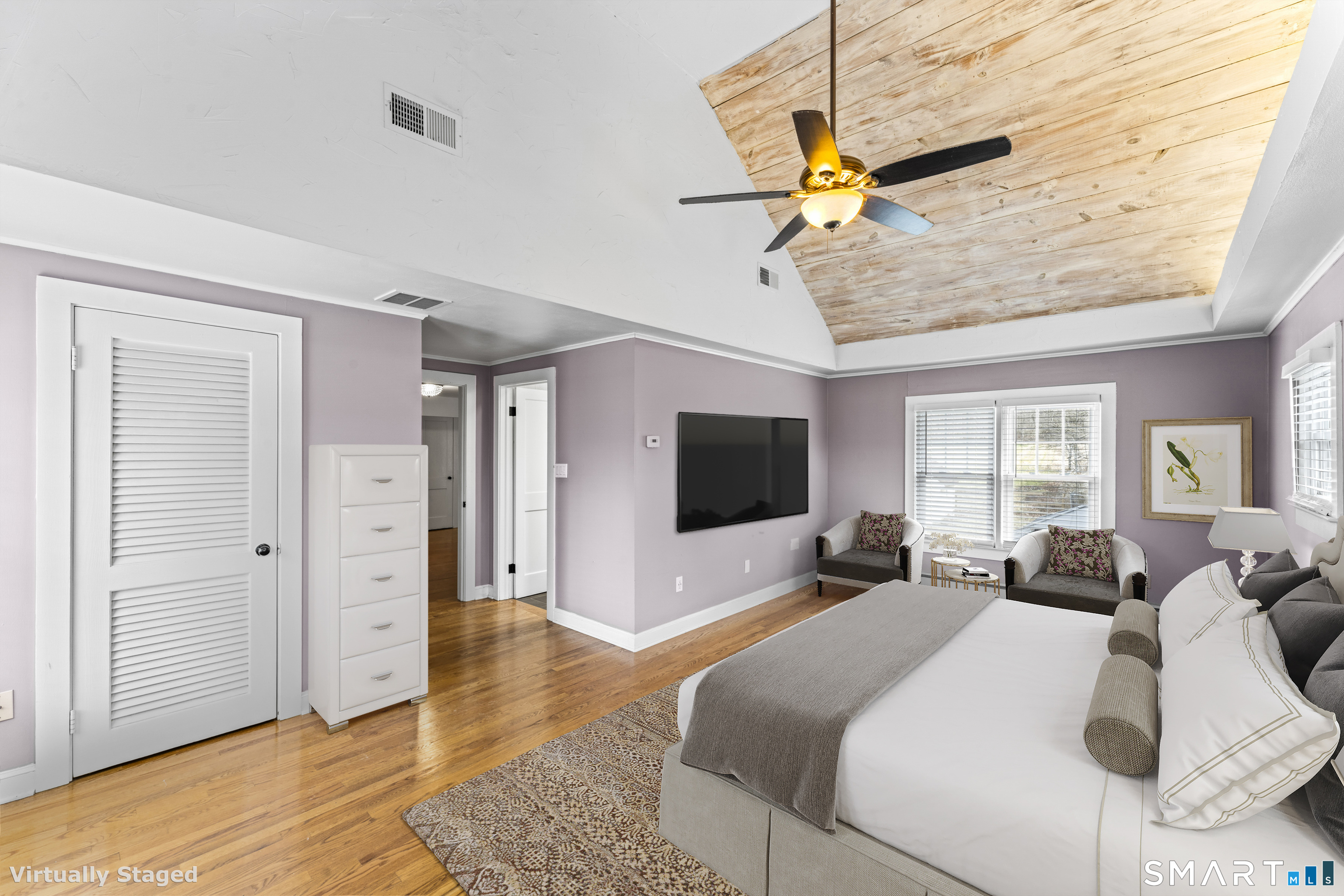 74 Middle Quarter Road Woodbury, CT 06798 - Photo 27 of 40 a bedroom with a bed and a flat screen tv