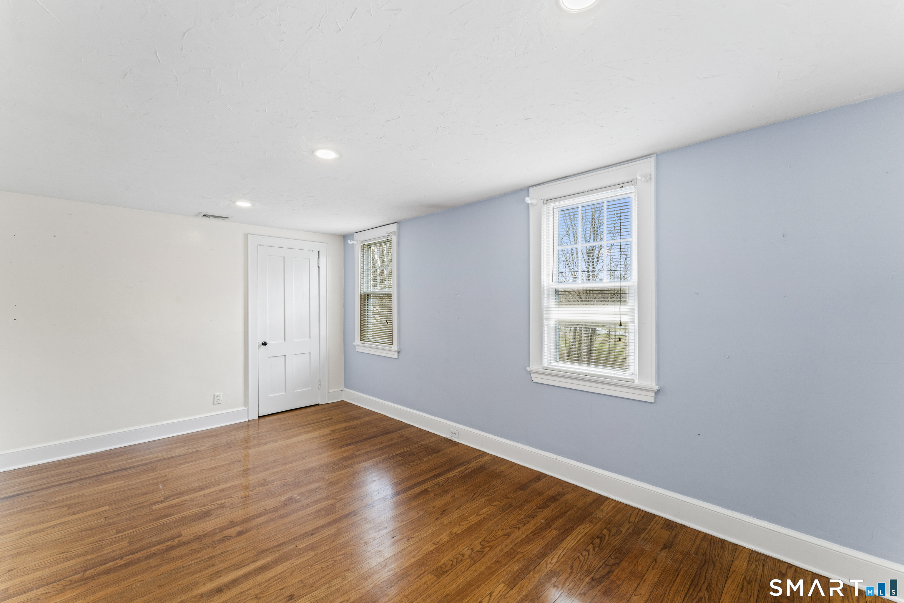 74 Middle Quarter Road Woodbury, CT 06798 - Photo 28 of 40 a view of an empty room with wooden floor and a window