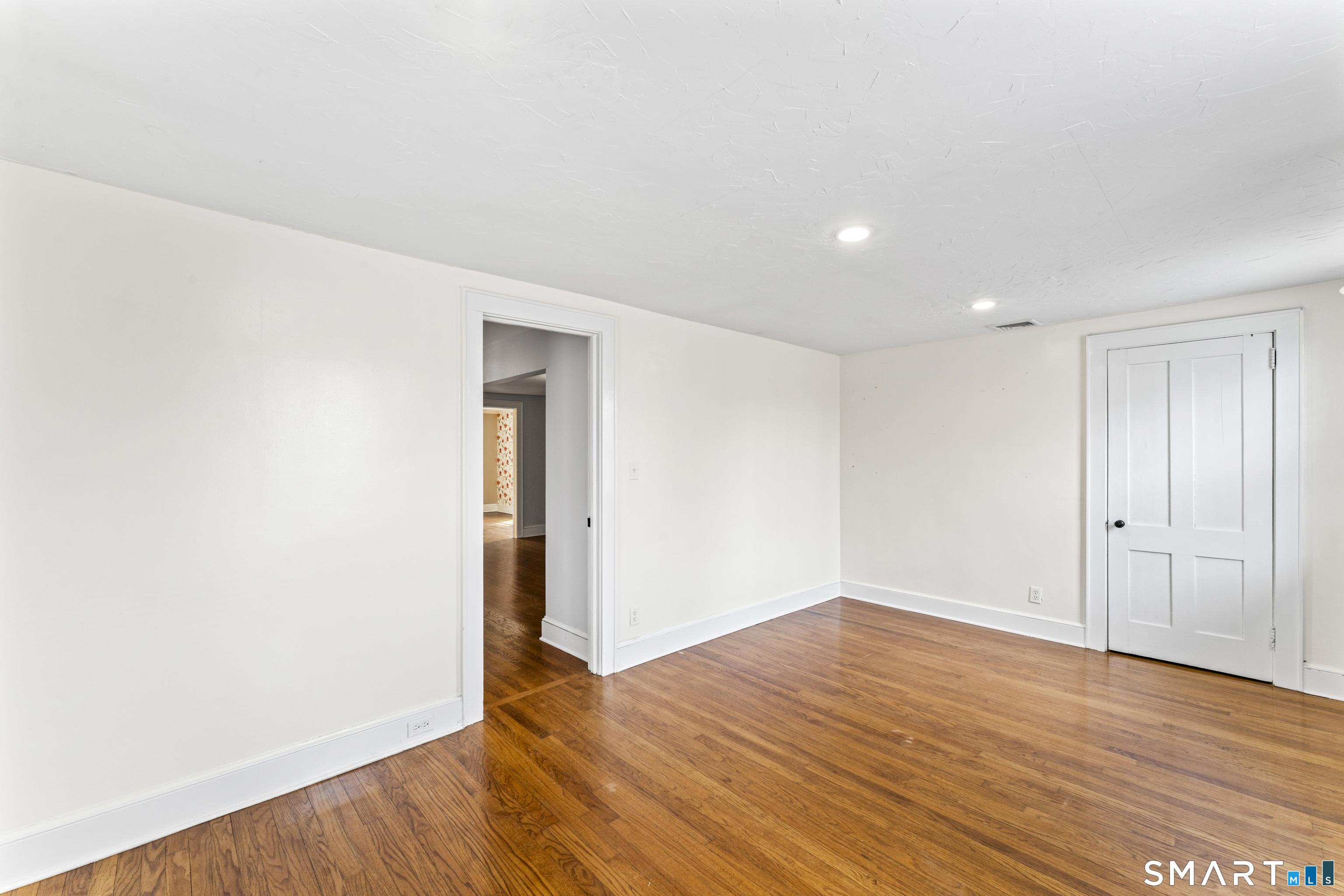 74 Middle Quarter Road Woodbury, CT 06798 - Photo 29 of 40 a view of an empty room with wooden floor and closet