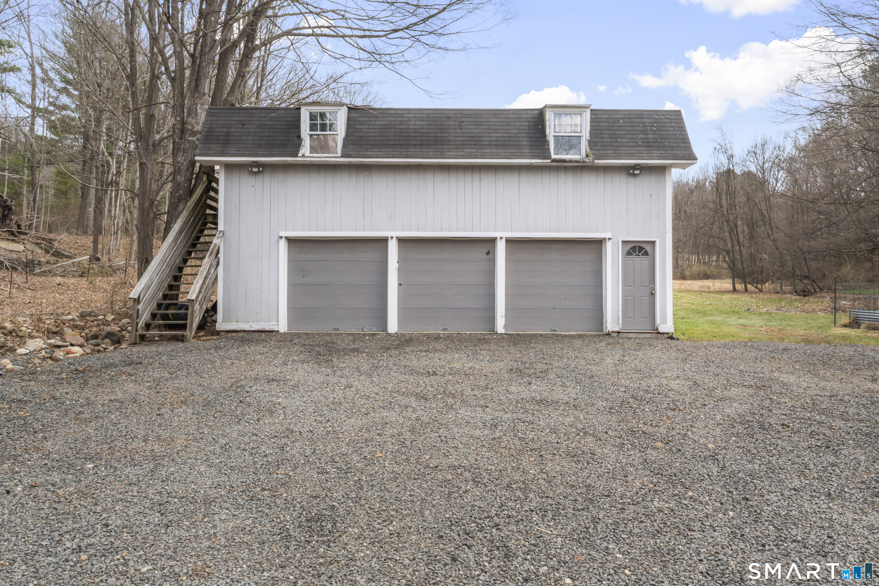 74 Middle Quarter Road Woodbury, CT 06798 - Photo 37 of 40 a view of a house with a yard and garage