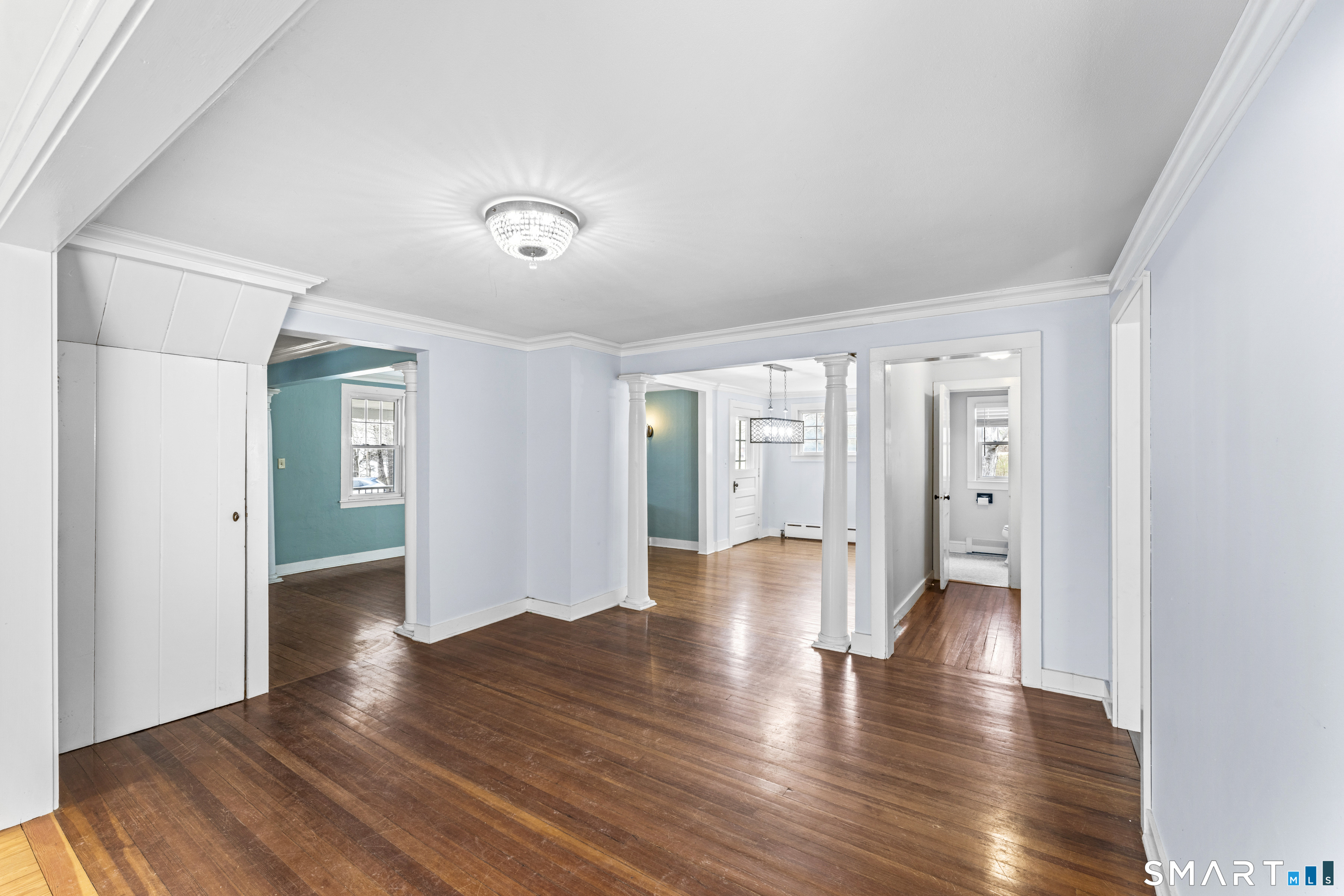 74 Middle Quarter Road Woodbury, CT 06798 - Photo 5 of 40 a view of an empty room with wooden floor