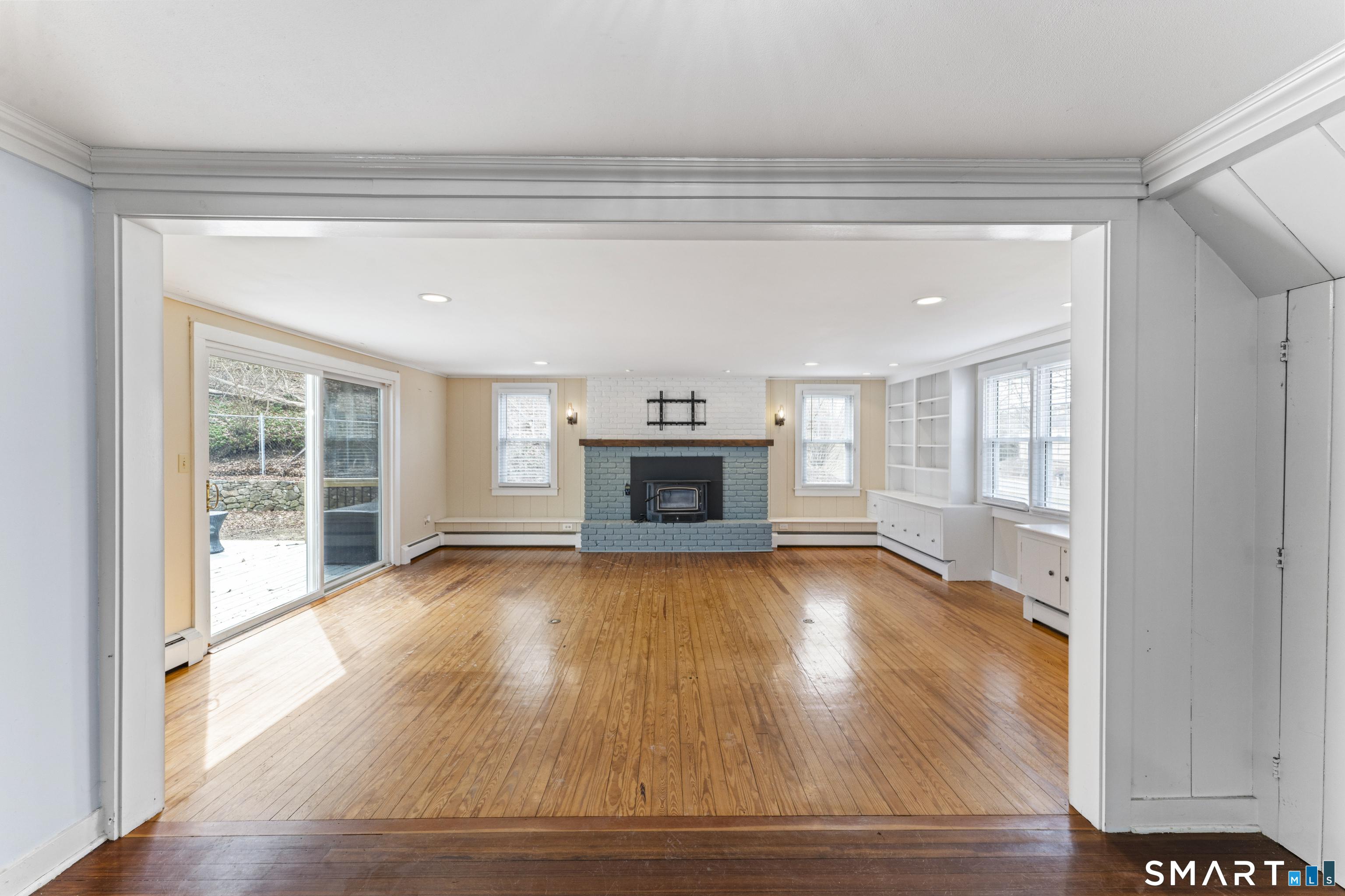 74 Middle Quarter Road Woodbury, CT 06798 - Photo 6 of 40 a view of an empty room with a window and fireplace