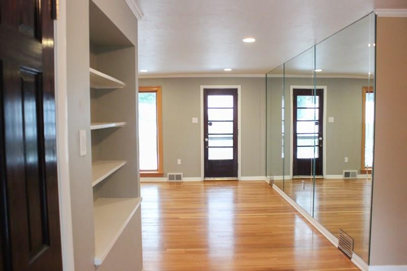 173 West Ingomar Road Pittsburgh, PA 15237 - Photo 4 of 20 Newly refinished hardwood floors and designer paint colors throughout. Looking to living room and exit to back patio.