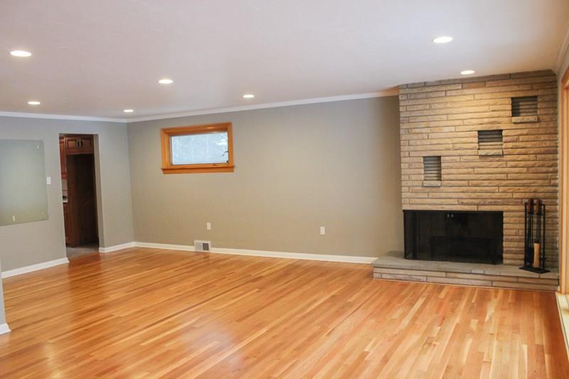 173 West Ingomar Road Pittsburgh, PA 15237 - Photo 7 of 20 The stone, wood burning fireplace is situated so the living and dining areas can enjoy.