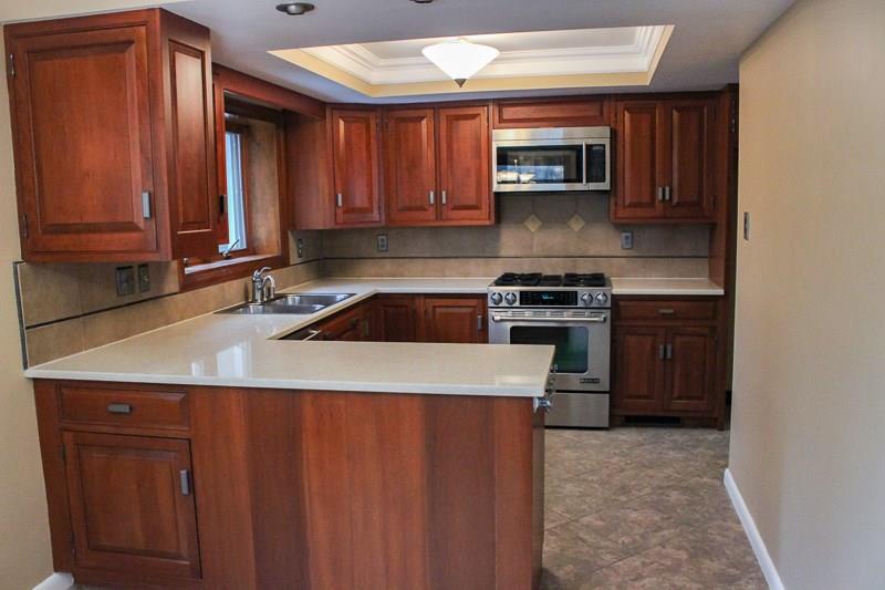 173 West Ingomar Road Pittsburgh, PA 15237 - Photo 10 of 20 Totally taken care of, Eat in kitchen featuring cherry cabinets and soft, neutral quartz counter tops.