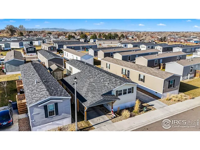 an aerial view of a house with a city view