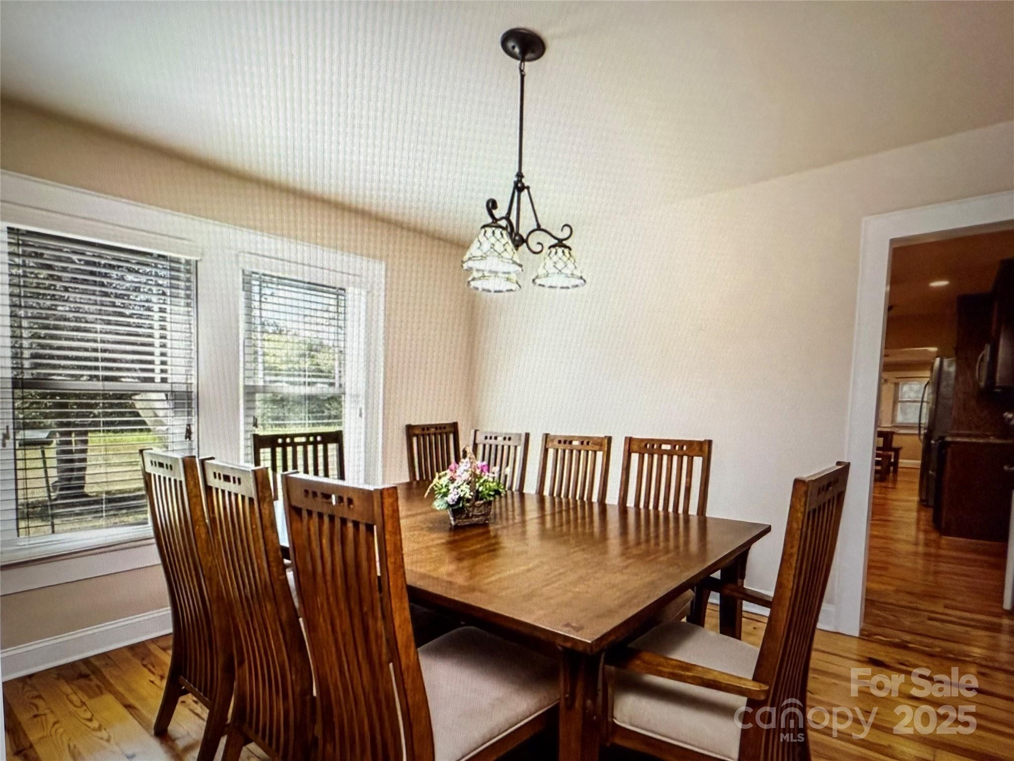 1170 Gold Knob Road Salisbury, NC 28146 - Photo 11 of 34 a view of a dining room with furniture window and wooden floor