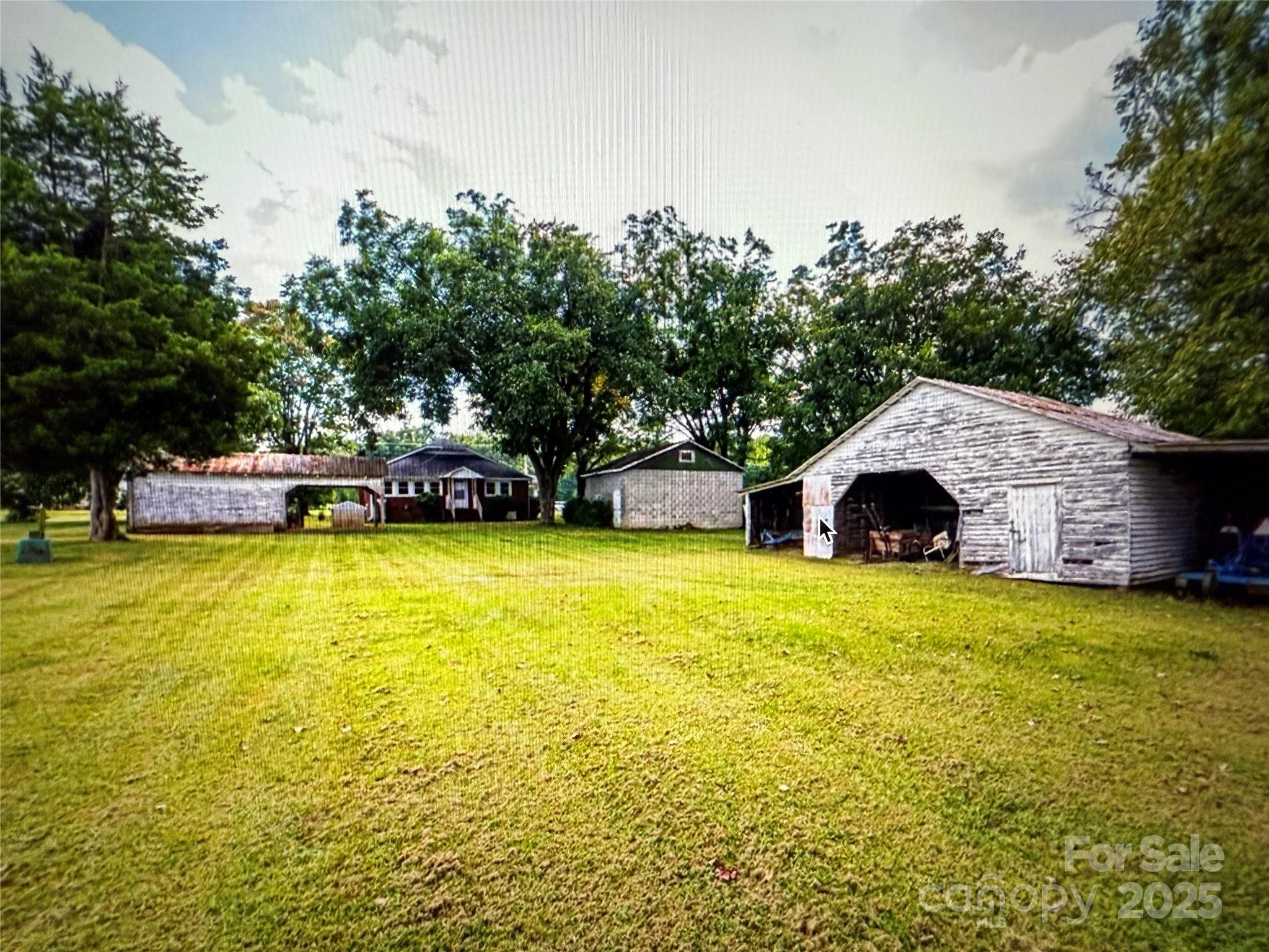 1170 Gold Knob Road Salisbury, NC 28146 - Photo 28 of 34 a yellow house with swimming pool in front of it