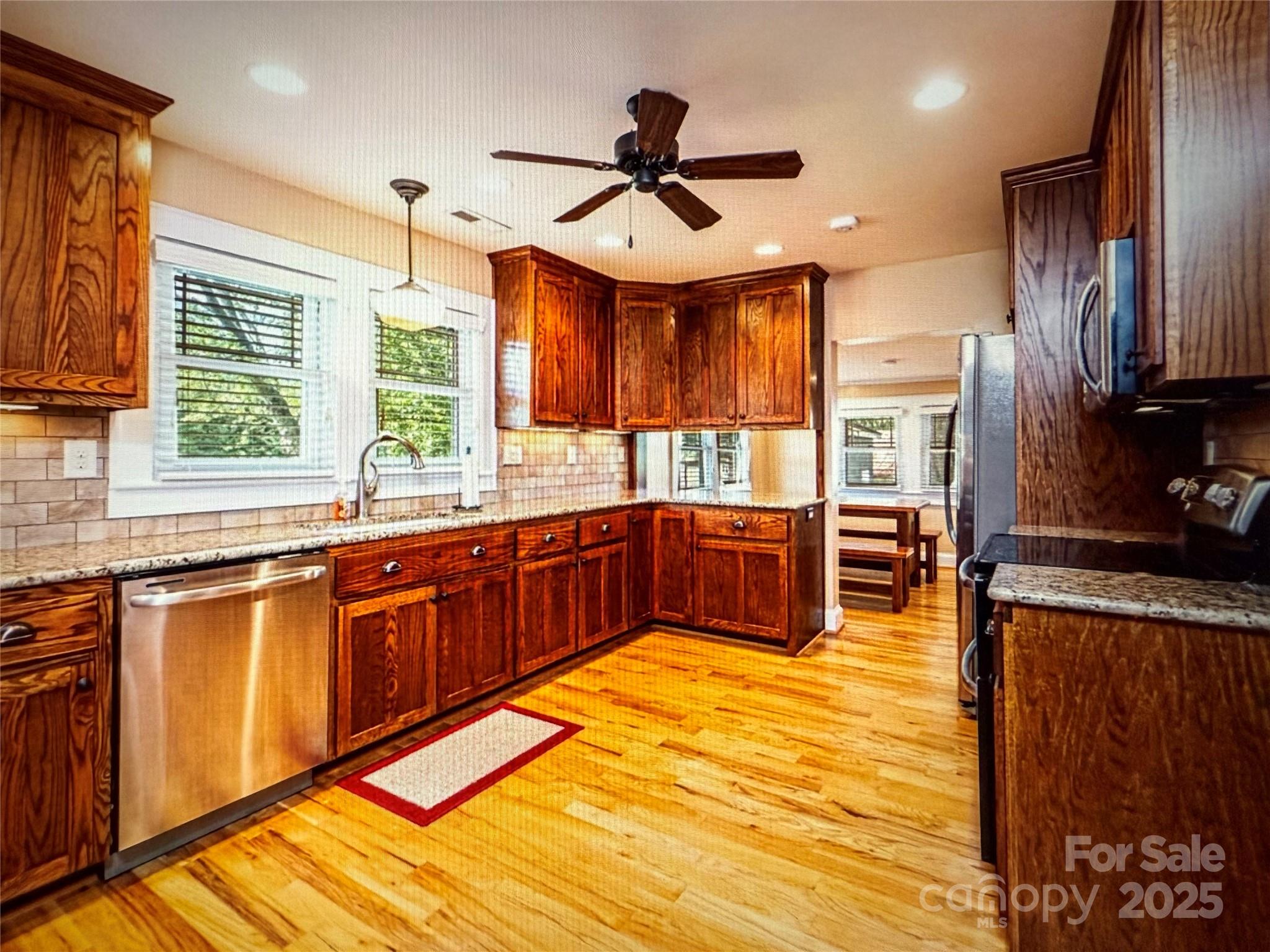 1170 Gold Knob Road Salisbury, NC 28146 - Photo 3 of 34 a kitchen with stainless steel appliances a sink counter space cabinets and a large window