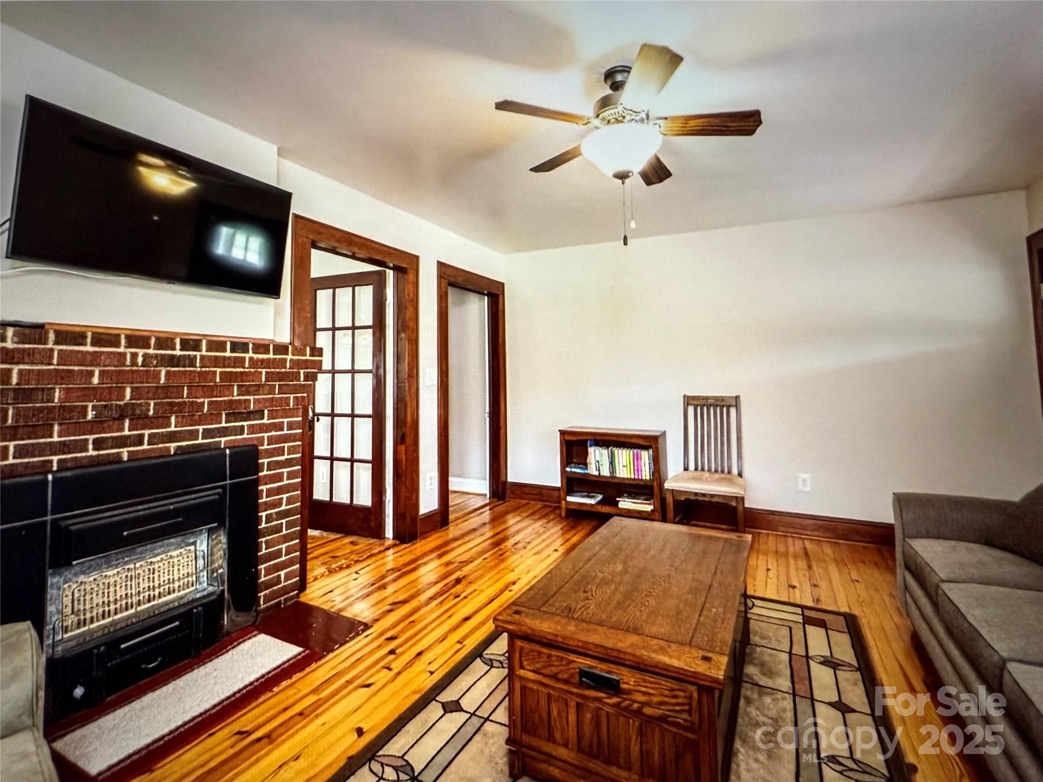 1170 Gold Knob Road Salisbury, NC 28146 - Photo 7 of 34 a living room with fireplace furniture and a flat screen tv