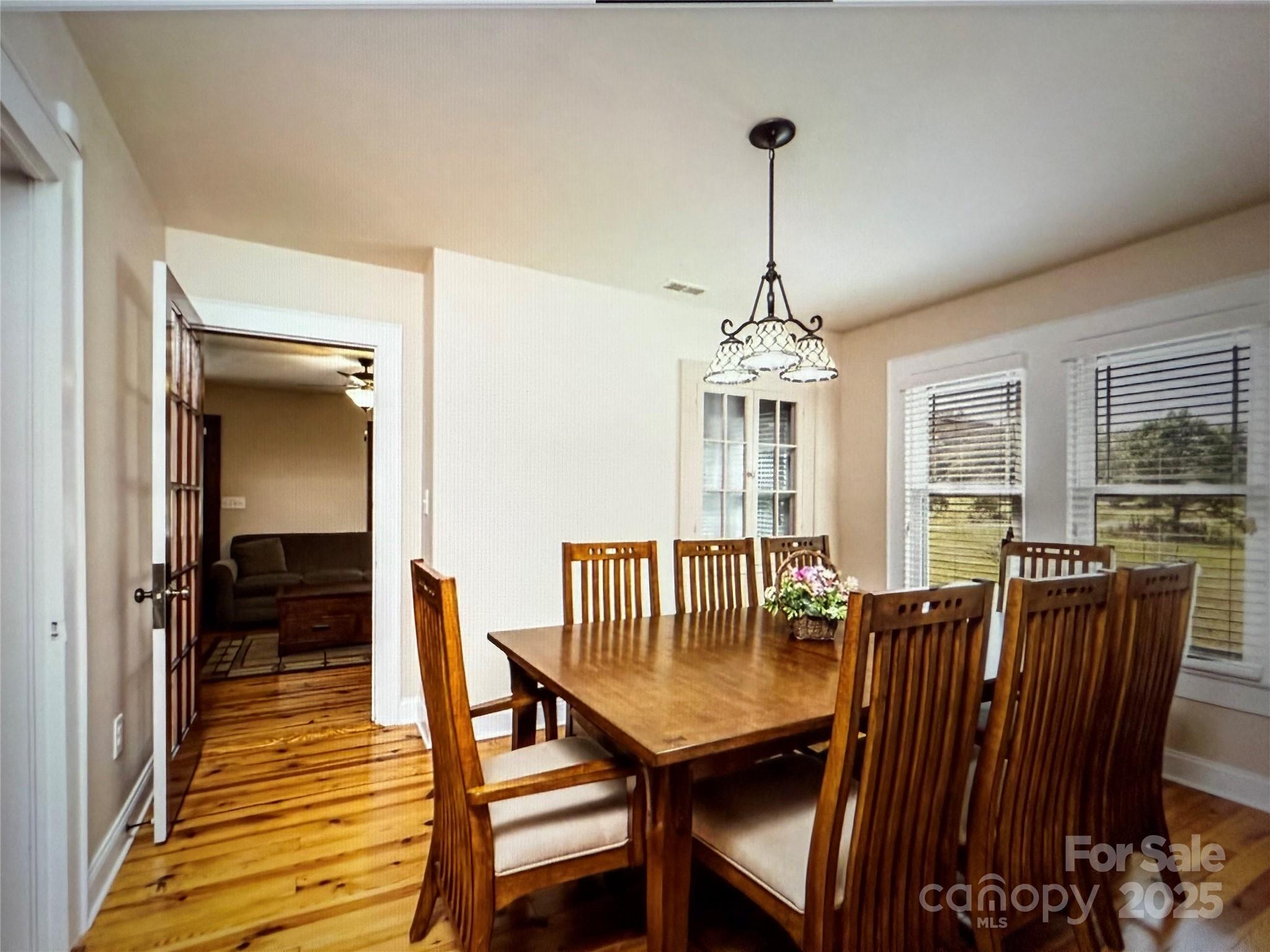 1170 Gold Knob Road Salisbury, NC 28146 - Photo 10 of 34 a view of a dining room with furniture window and wooden floor
