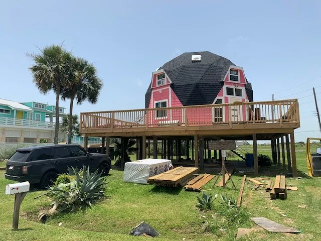 a swimming pool with outdoor seating and yard