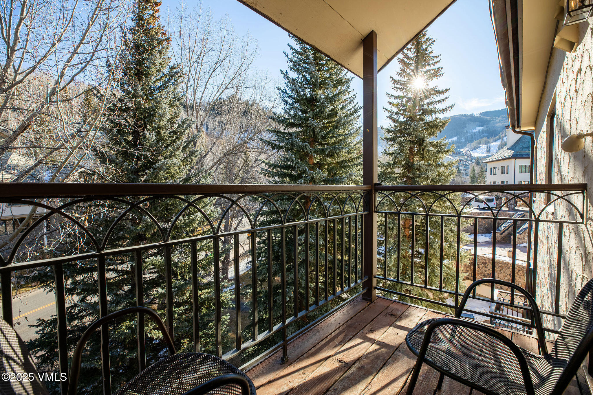 120 Offerson Road, Unit 7410/15 Beaver Creek, CO 81620 - Photo 4 of 15 a view of balcony with wooden floor and fence