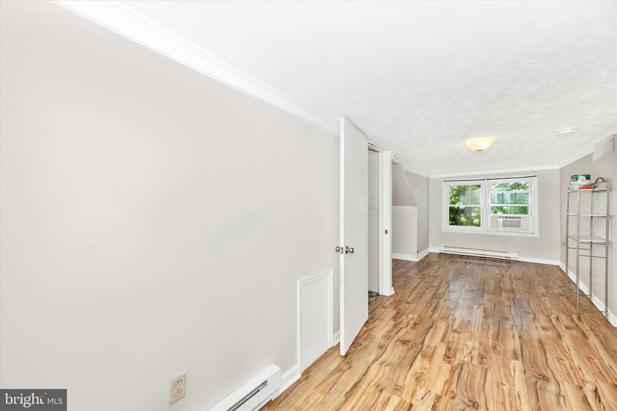 214 Jackson Street Hancock, MD 21750 - Photo 14 of 40 a view of a room with wooden floor and a window