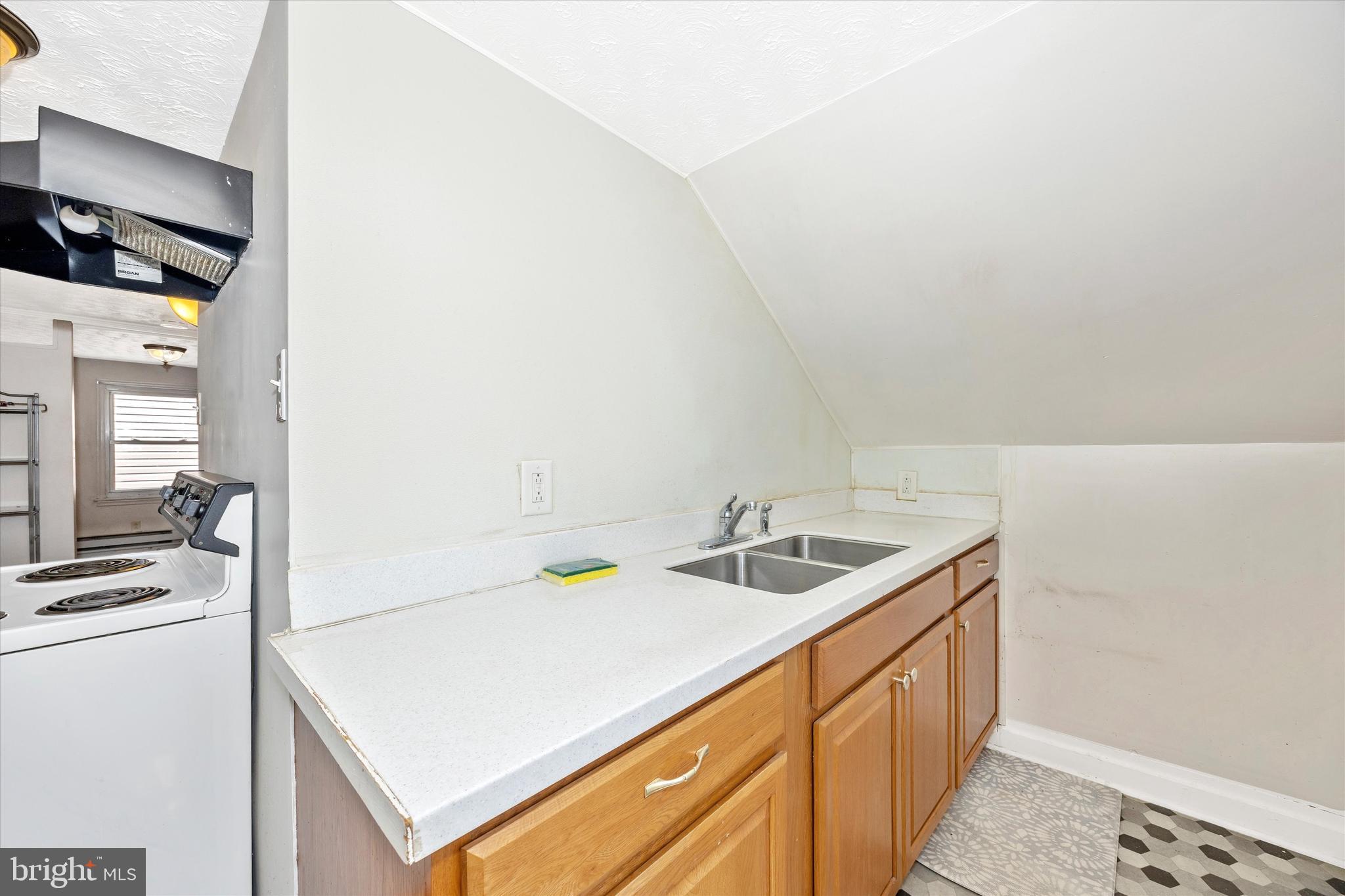 214 Jackson Street Hancock, MD 21750 - Photo 18 of 40 a bathroom with a sink and a mirror
