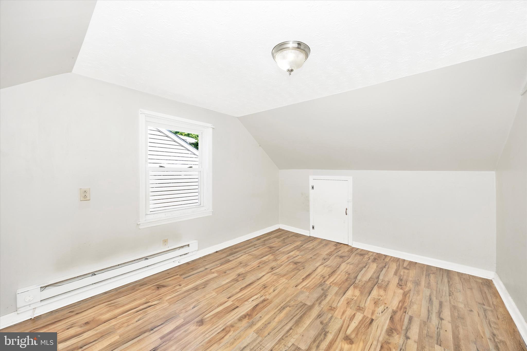 214 Jackson Street Hancock, MD 21750 - Photo 22 of 40 a view of empty room with wooden floor and fan