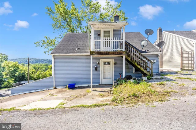 a house view with a swimming pool