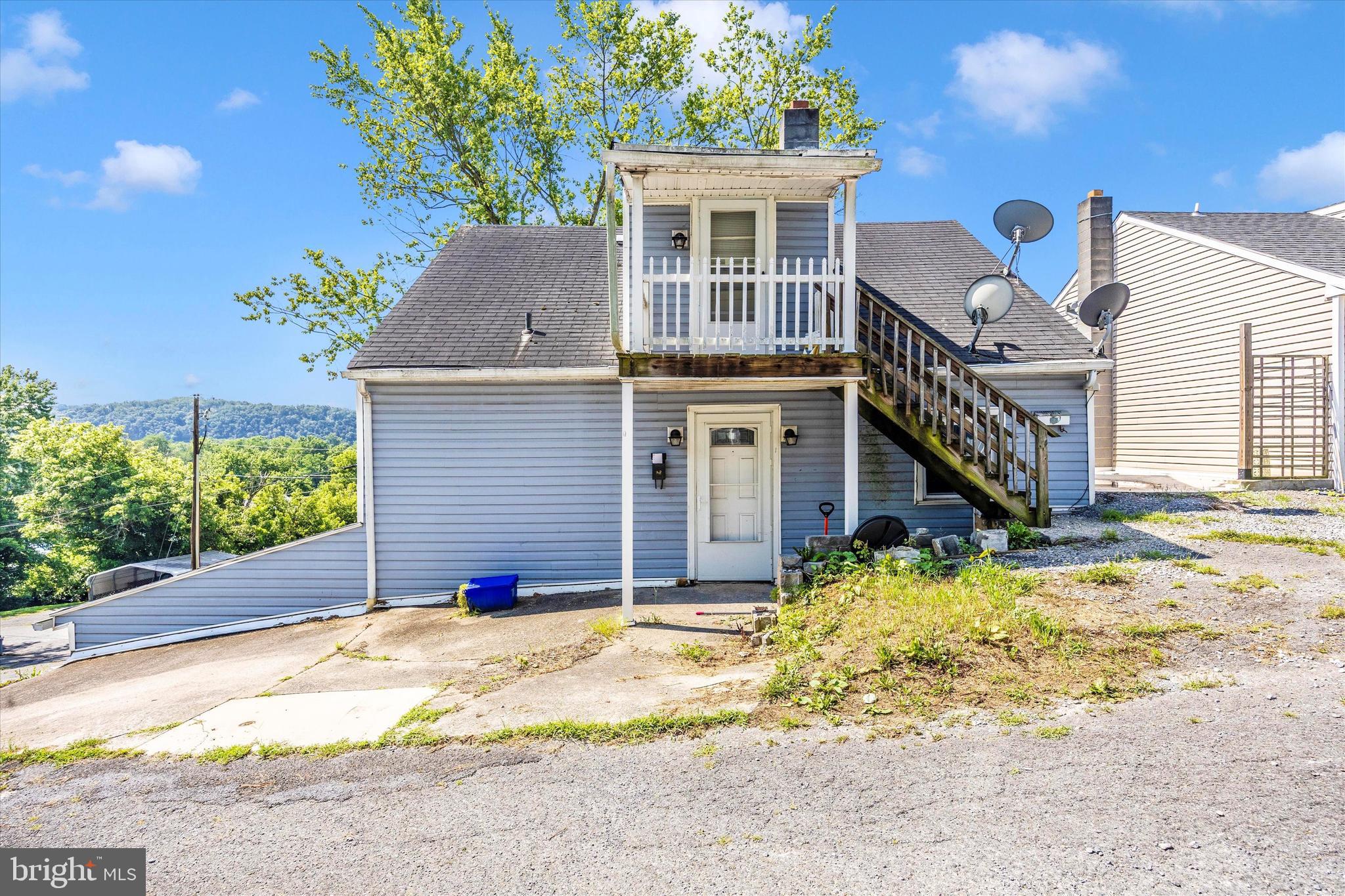 214 Jackson Street Hancock, MD 21750 - Photo 28 of 40 front view of a house with a yard