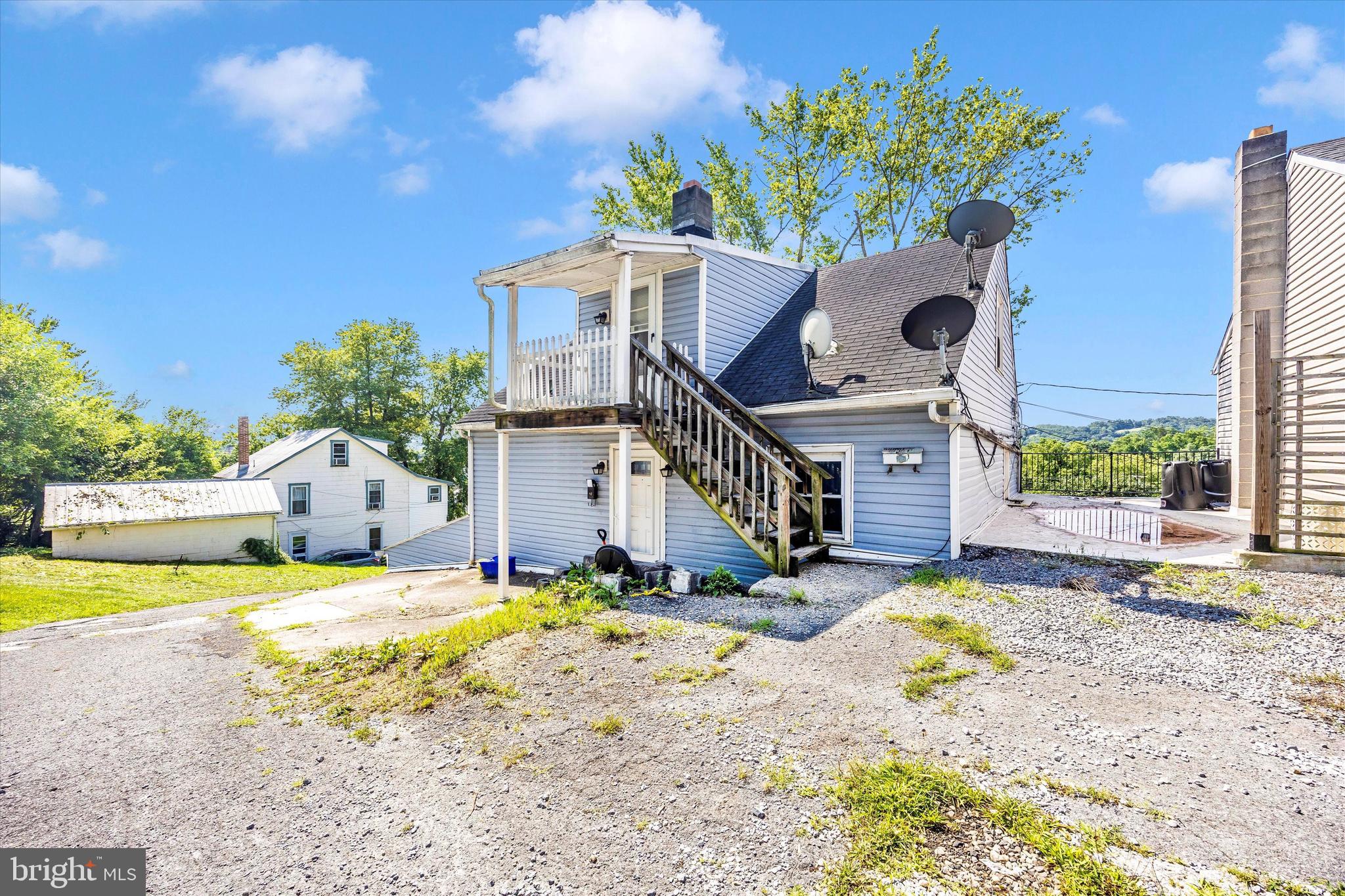 214 Jackson Street Hancock, MD 21750 - Photo 29 of 40 a house view with a swimming pool
