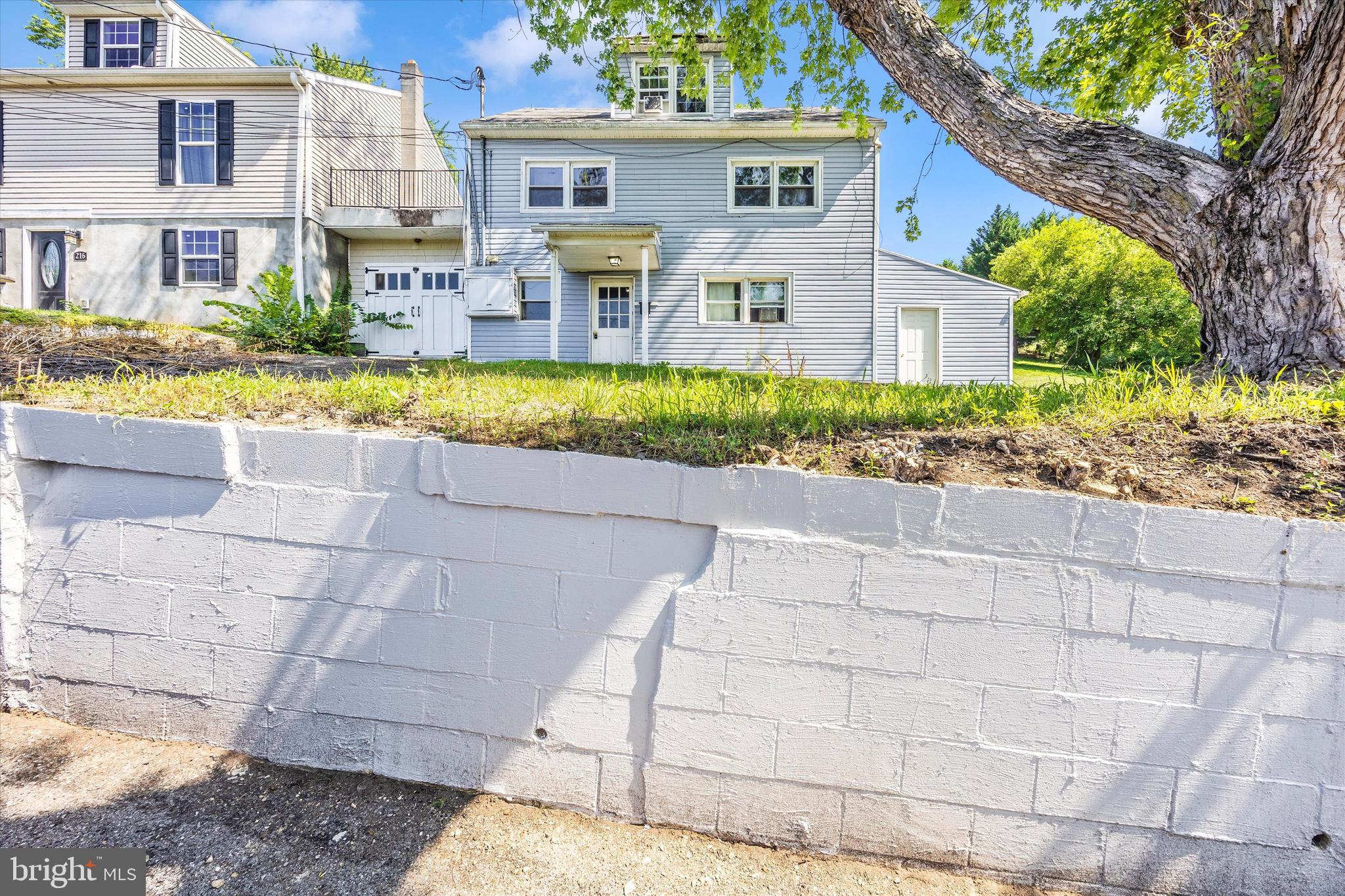 214 Jackson Street Hancock, MD 21750 - Photo 31 of 40 a front view of a house with a yard